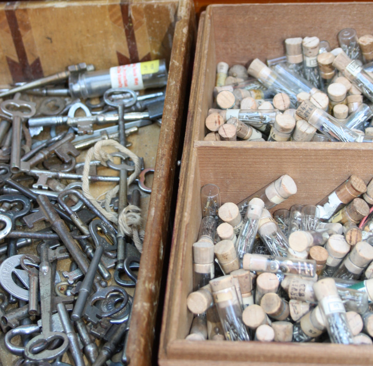 keys and watch part vials